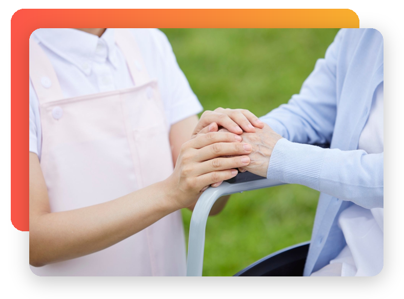 Caregiver holding a patient’s hand